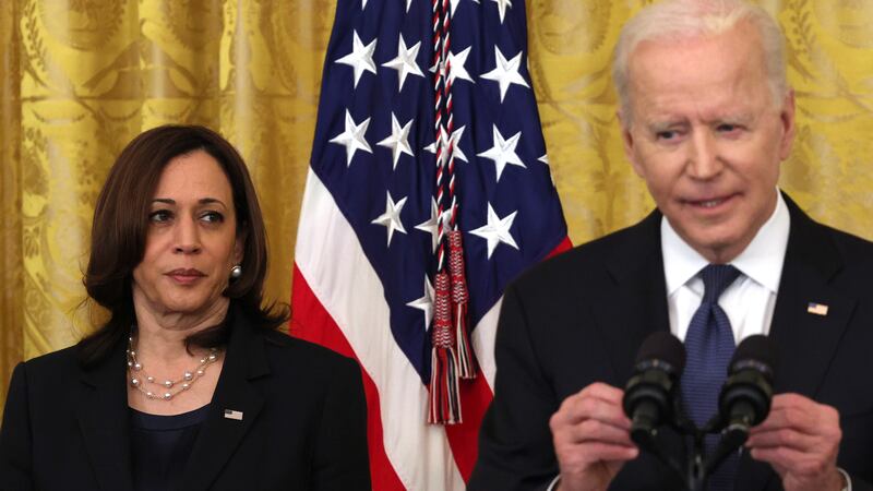 Vice President Kamala Harris listens as U.S. President Joe Biden.
