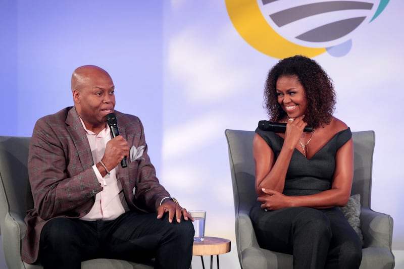 Craig Robinson (L) and Michelle Obama (R)
