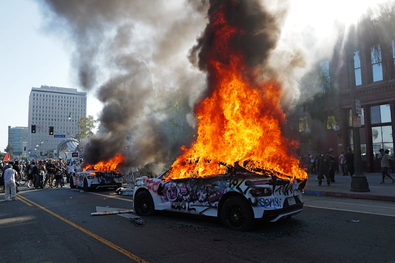 Waymo cars are set on fire and vandalized during a protest against immigration raids on June 08, 2025 in Los Angeles.