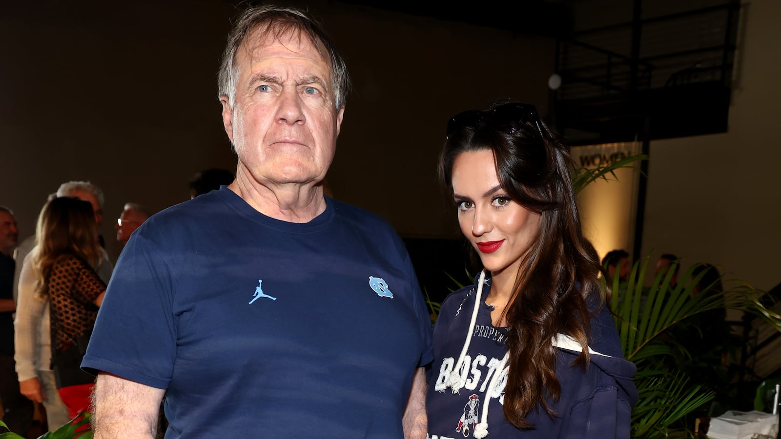 Bill Belichick (L) and Jordon Hudson (R)
