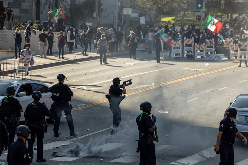 Protesters clash with law enforcement in the streets surrounding the federal building during a protest following federal immigration operations in Los Angeles, California, on June 8.