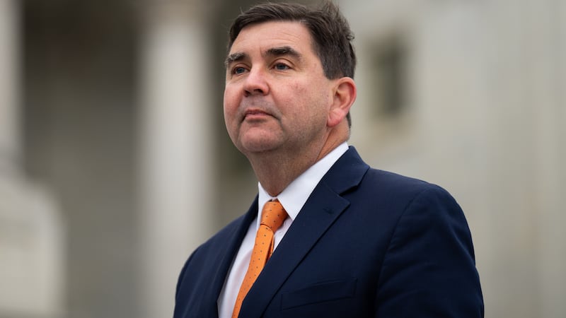 John Mannion poses for a photo on the the House steps of the Capitol.