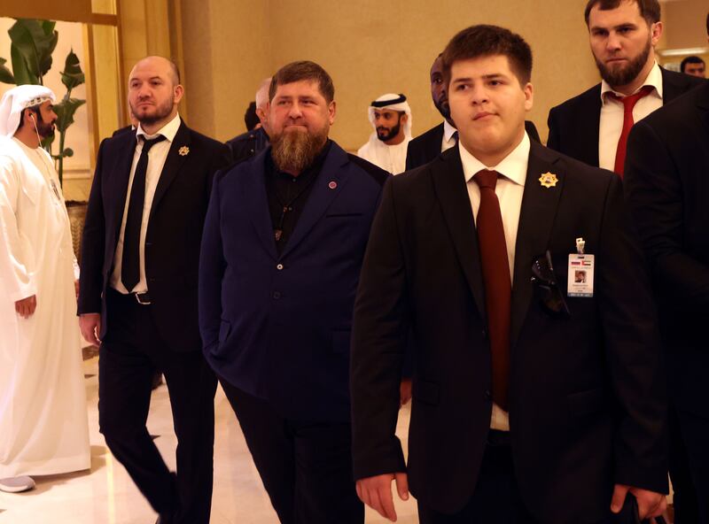 A photo of Adam Kadyrov walking with his father Ramzan.