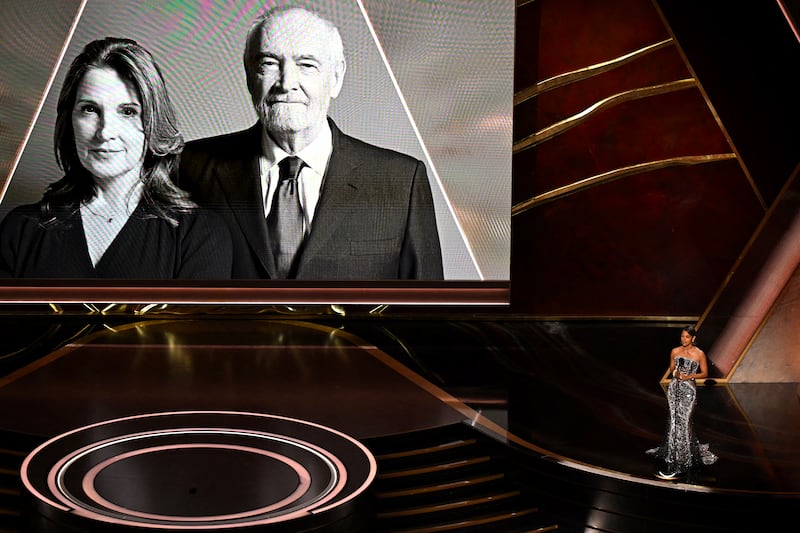 US actress Halle Berry speaks onstage as an image of US film producer Michael G Wilson and British film producer Barbara Broccoli is shown onscreen during the 97th Annual Academy Awards at the Dolby Theatre in Hollywood, California on March 2, 2025. (Photo by Patrick T. Fallon / AFP) (Photo by PATRICK T. FALLON/AFP via Getty Images)