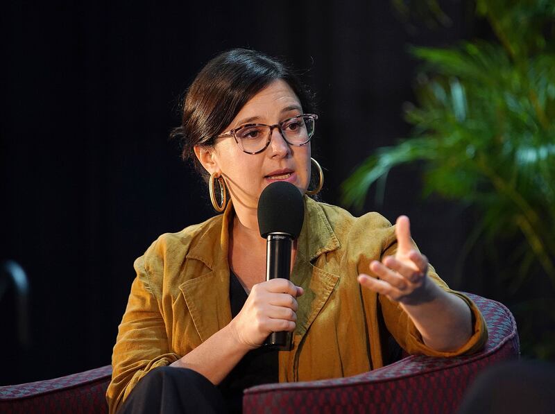 Bari Weiss talks into a microphone