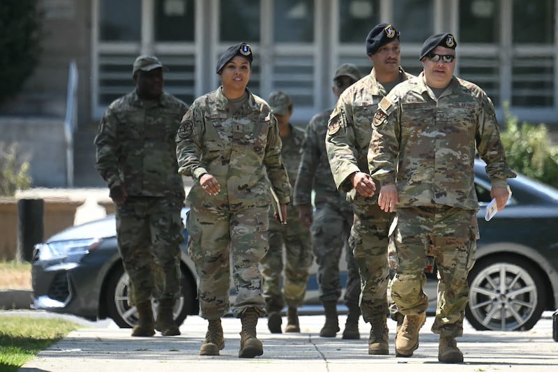 Members of the National Guard walk from the DC Joint Force Headquarters to the DC Armory in Washington, DC