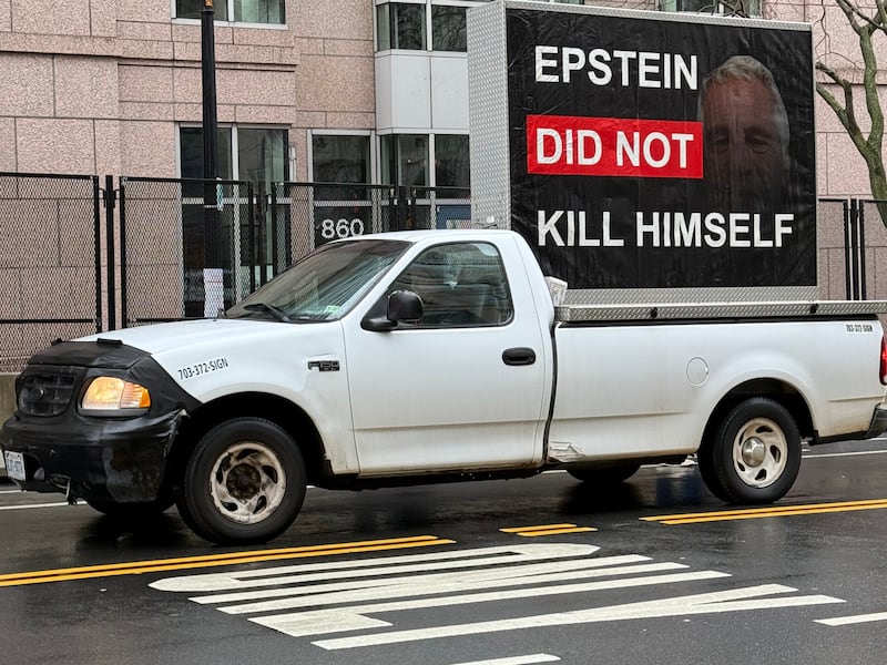 Truck with screen: "Epstein Did Not Kill Himself."