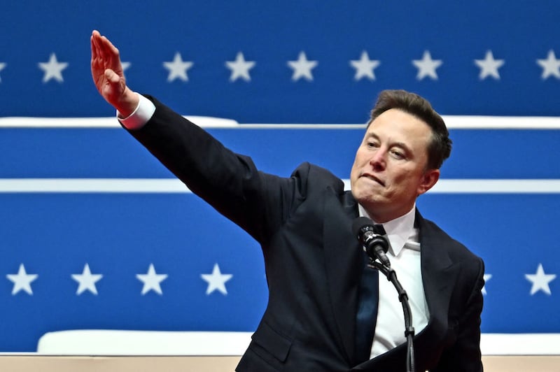 Elon Musk performs a particularly provocative gesture as he speaks during an inauguration day event following the swearing-in of President Donald Trump.