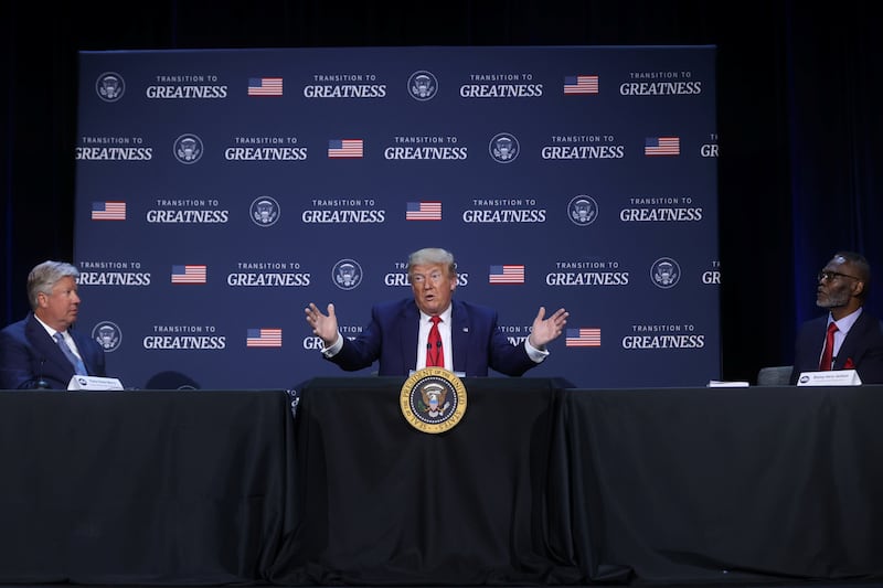 Then-President Donald Trump is flanked by Pastor Robert Morris and Gateway Church Bishop Harry Jackson during a roundtable at Gateway Church in June 2020.