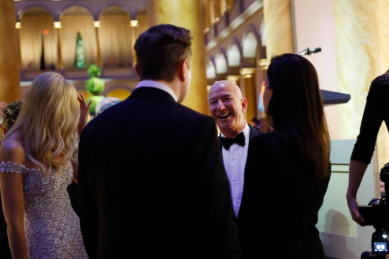 WASHINGTON, DC - JANUARY 19: Jeff Bezos (2nd from right) converses with guests including Ivanka Trump (L) and Elon Musk (2nd from left) at a candlelight dinner for U.S. President-elect Donald Trump at the National Building Museum on January 19, 2025 in Washington, DC. Trump will be sworn in as the 47th U.S. president on January 20. (Photo by Anna Moneymaker/Getty Images)