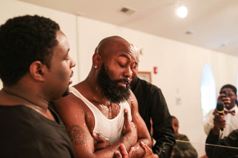 articles/2014/11/27/the-baptism-of-michael-brown-sr-and-ferguson-s-baptism-by-fire/141127-glawe-baptism2-embed_ztviba