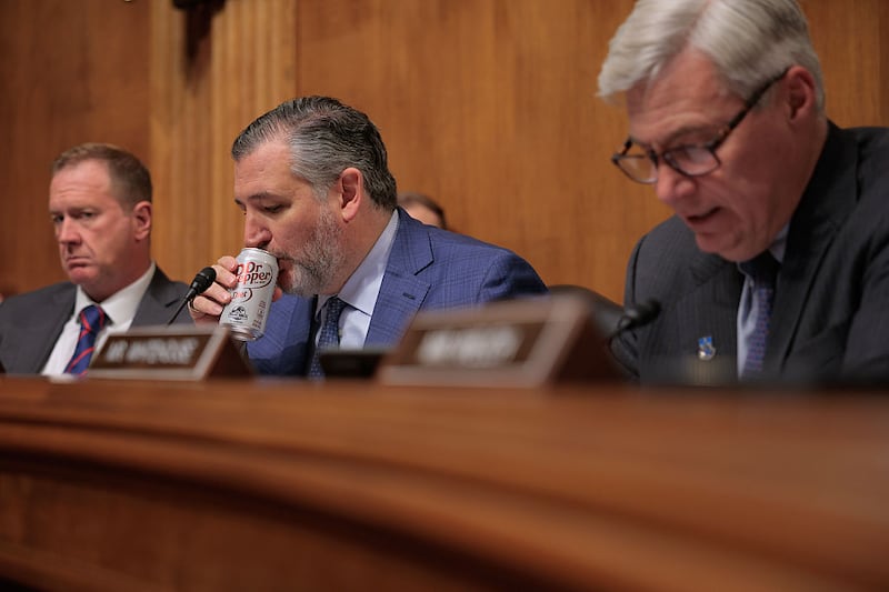 WASHINGTON, DC - JUNE 03: Senate Judiciary Committee member Sen. Ted Cruz (R-TX) (C) sips soda during a subcommittee hearing about the unprecedented number of nationwide judicial injunctions against the Trump Administration with Sen. Eric Schmidt (R-MO) (L) and Sen. Sheldon Whitehouse (D-RI) in the Dirksen Senate Office Building on Capitol Hill on June 03, 2025 in Washington, DC. The hearing, titled "The Supposedly 'Least Dangerous Branch': District Judges v. Trump," was conducted by the combined subcommittees on The Constitution and The Federal Courts, Oversight, Agency Action, and Federal Rights. (Photo by Chip Somodevilla/Getty Images)