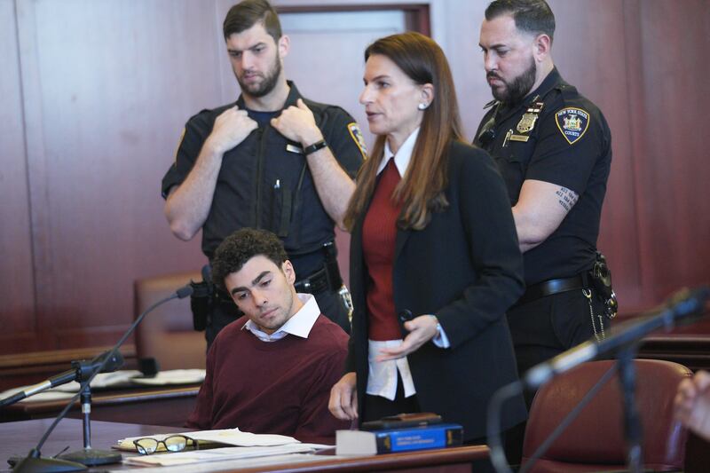 NEW YORK, NEW YORK - DECEMBER 23: Luigi Mangione appears with his attorney Karen Friedman Agnifilo for his arraignment at Manhattan Criminal Court on December 23, 2024 in New York City. Mangione, 26, was arraigned on state murder charges in the killing of UnitedHealthcare CEO Brian Thompson on a Manhattan street on December 4.