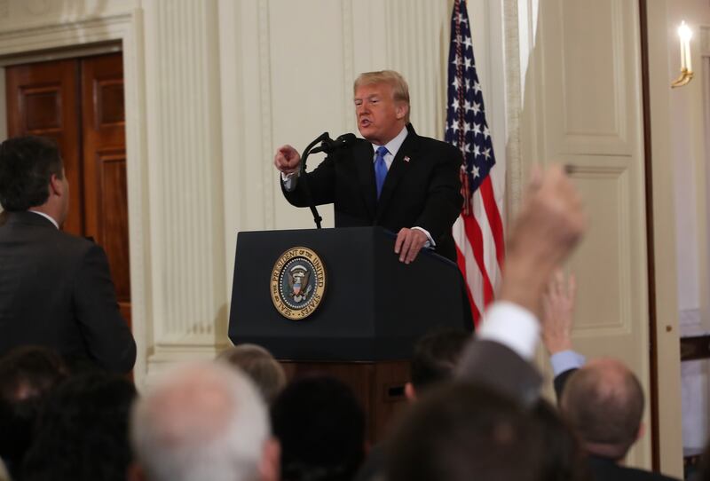 U.S. President Donald Trump gets into an exchange with Jim Acosta of CNN after giving remarks a day after the midterm elections on November 7, 2018 in the East Room of the White House in Washington, DC.