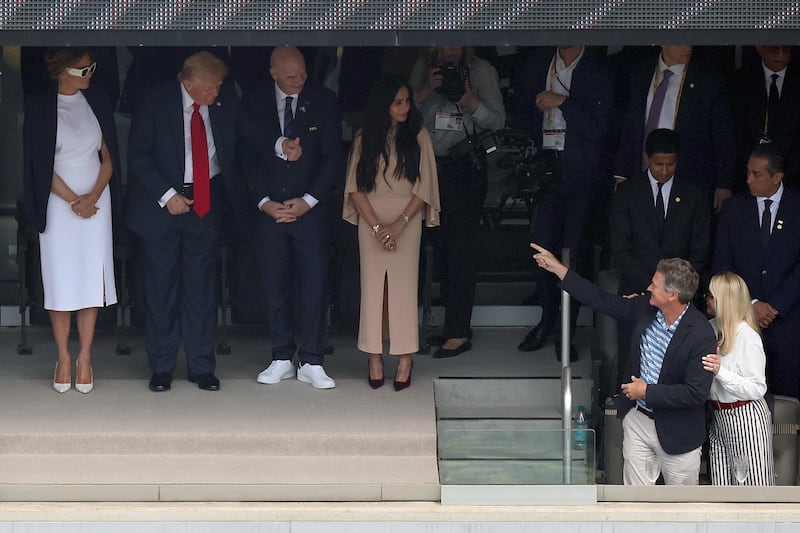 US President Donald Trump (2nd-L) gives a thumbs up to US Attorney General Pam Bondi (R) and her partner John Wakefield ahead of the FIFA Club World Cup 2025 final football match between England's Chelsea and France's Paris Saint-Germain at the MetLife Stadium in East Rutherford, New Jersey on July 13, 2025. (Photo by CHARLY TRIBALLEAU / AFP) (Photo by CHARLY TRIBALLEAU/AFP via Getty Images)