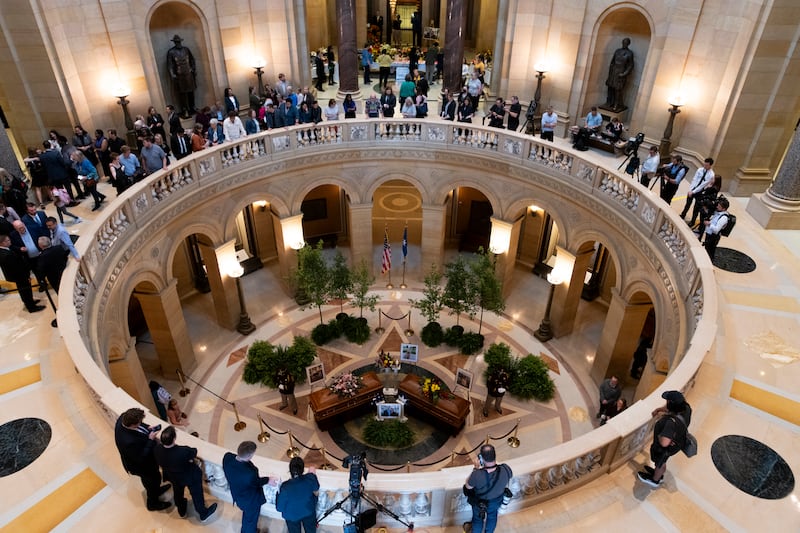 People look on as Rep. Melissa Hortman, her husband Mark Hortman, and their dog Gilbert lie in state in the rotunda of the Capitol building on June 27 in St. Paul, Minnesota.