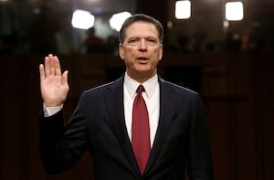 FILE PHOTO: Former FBI Director James Comey is sworn in prior to testifying before a Senate Intelligence Committee hearing on Russia's alleged interference in the 2016 U.S. presidential election on Capitol Hill in Washington, U.S., June 8, 2017. REUTERS/Jonathan Ernst//File Photo