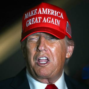 Donald Trump talks to journalists as he arrives at Joint Base Andrews, Maryland early on July 4, 2025.
