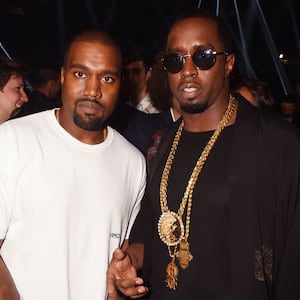 Kanye West and Sean Diddy Combs pose backstage during the 2016 MTV Video Music Awards.
