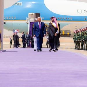 Donald Trump walks with Saudi Crown Prince Mohammed Bin Salman on a purple carpet during a welcoming ceremony in Riyadh, Saudi Arabia.