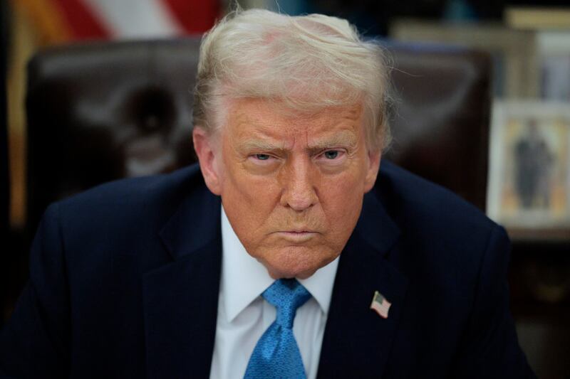 U.S. President Donald Trump talks to reporters after signing an executive order, "Unleashing prosperity through deregulation," in the Oval Office on January 31, 2025 in Washington, DC.