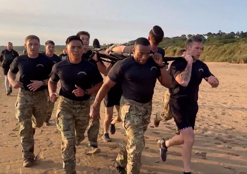 Warrior Hegseth (right) is having more luck with doing PT than with battling DEI.