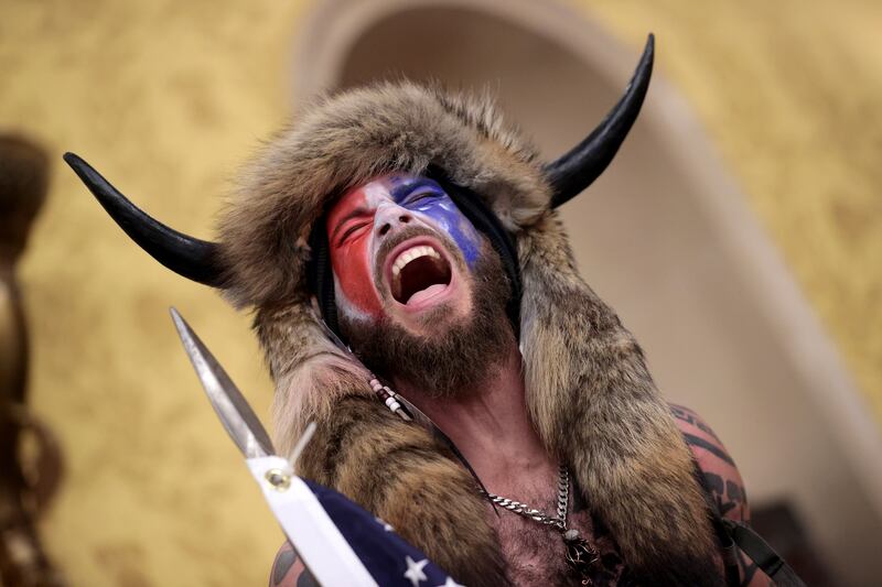 The QAnon Shaman screams "Freedom" inside the Senate chamber after the U.S. Capitol was breached by a mob during a joint session of Congress on January 06, 2021 in Washington, DC.