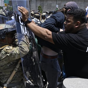 National guards confront with protesters outside of the Metropolitan Detention Center in Los Angeles.