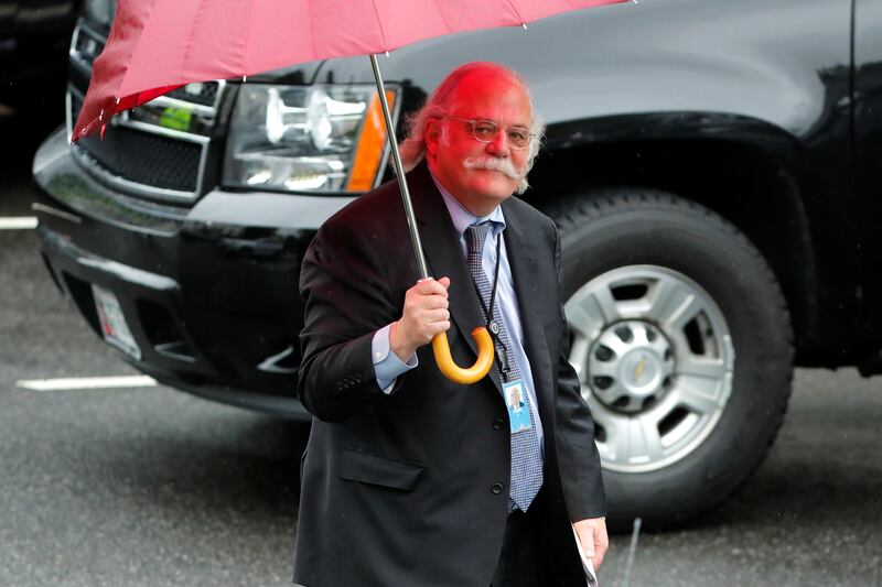 Outgoing White House attorney Ty Cobb walks to his car at the White House in Washington, U.S. May 17, 2018.