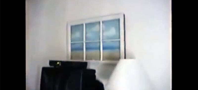 Artwork featuring a twee beachy scene in a bedroom at Jeffrey Epstein's Palm Beach mansion.
