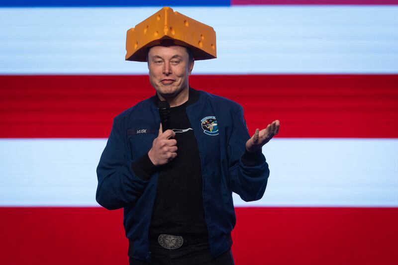 Musk arrived to a Green Bay town hall wearing a cheesehead hat.