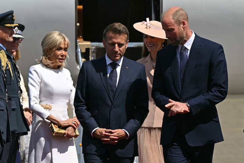 WINDSOR, ENGLAND - JULY 8: France's President Emmanuel Macron (2nd L) and his wife Brigitte Macron (L) are greeted by Prince William, Prince of Wales (R) and Catherine, Princess of Wales (2nd R) upon arrival at RAF Northolt on July 8, 2025 in Windsor, England. President Emmanuel Macron and Mrs Brigitte Macron visit the UK in the first visit State Visit made by France in 17 years. They are staying at Windsor Castle, hosted by King Charles III and Queen Camilla, and a banquet will be held there in their honour. The Macrons will visit Imperial College, and the President will address Parliament during his stay.  (Photo by Justin Tallis - WPA Pool/Getty Images)