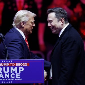 Elon Musk walks on stage with his son, X, beside President-elect Donald Trump during a rally at Capital One Arena in Washington, on January 19, 2025.