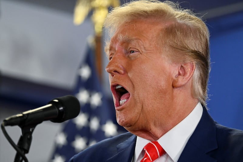 Former President Donald Trump campaigns in Newton, Iowa.