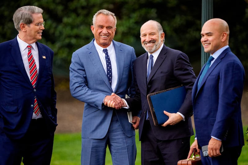 WASHINGTON, DC - MARCH 28: (L-R) Treasury Secretary Scott Bessent, U.S. Health and Human Services Secretary Robert F. Kennedy Jr., Commerce Secretary Howard Lutnick, and aide Walt Nauta wait for U.S. President Donald Trump to board Marine One on the South Lawn of the White House on March 28, 2025 in Washington, DC.