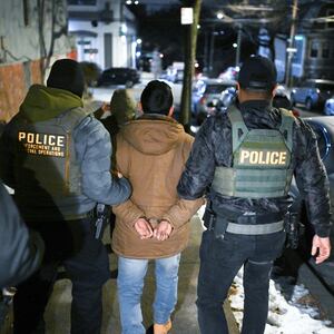 NEW YORK, NY - JANUARY 28: Law enforcement walk with Leonardo Fabian Cando Juntamay as he was detained in the Bronx during ICE led operations to apprehend illegal immigrants on Tuesday January 28, 2025 in New York, NY.