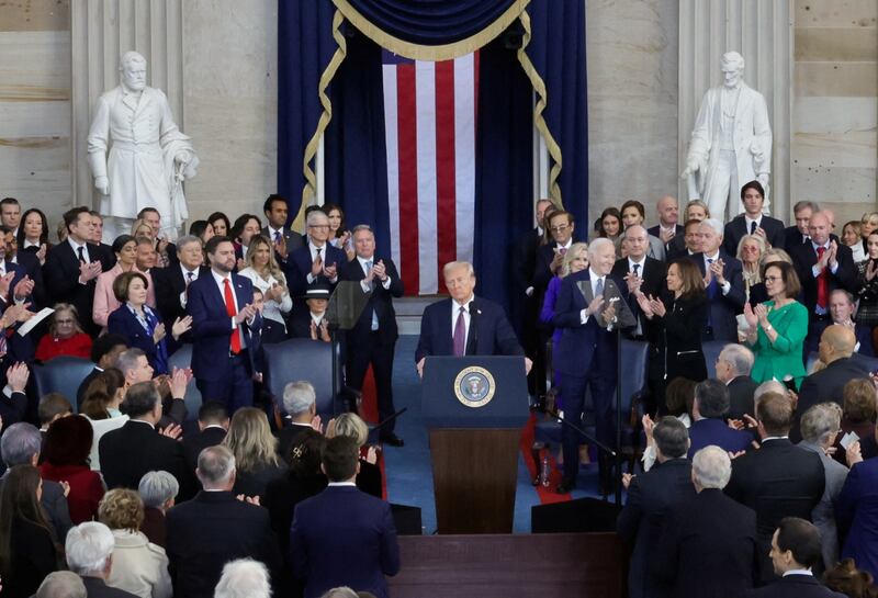 Attendees applaud U.S. President Donald Trump on the day of his Presidential Inauguration at the Rotunda of the U.S. Capitol in Washington, U.S. January 20, 2025. REUTERS/Fabrizio Bensch/Pool