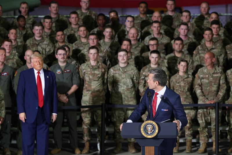 Defense Secretary Pete Hegseth turns to President Donald Trump as he speaks during a visit Selfridge Air National Guard Base in Michigan on April 29, 2025.