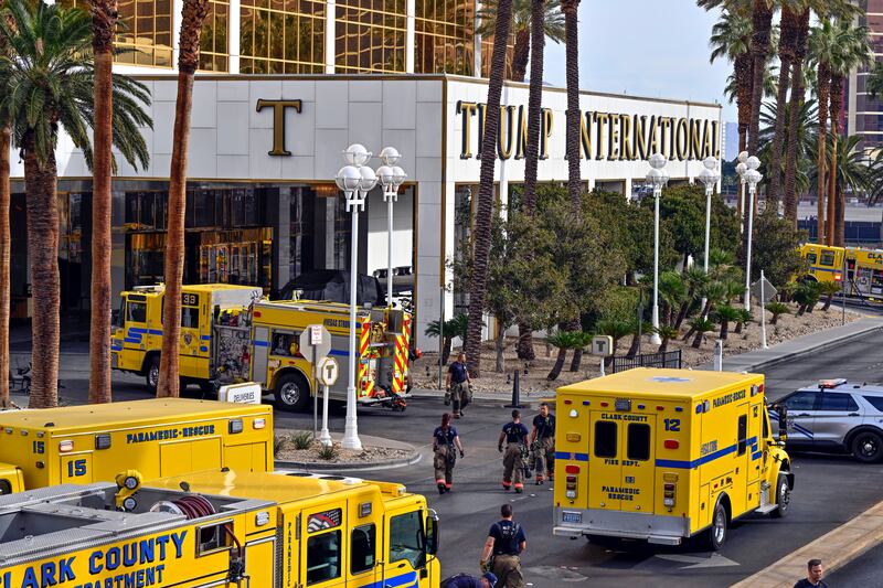 Clark County fire vehicles surround the valet area where a Cybertruck caught fire at the Trump International Hotel.