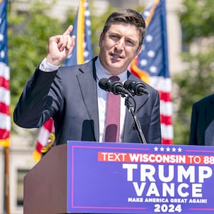 Rep. Bryan Steil addresses the audience at a Trump campaign rally while then-Sen. J.D. Vance looks on at a campaign rally on August 20, 2024 in Kenosha, Wisconsin.