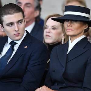 Barron Trump and first lady Melania Trump listen as President Donald Trump gives his inaugural address in the U.S. Capitol Rotunda on January 20, 2025
