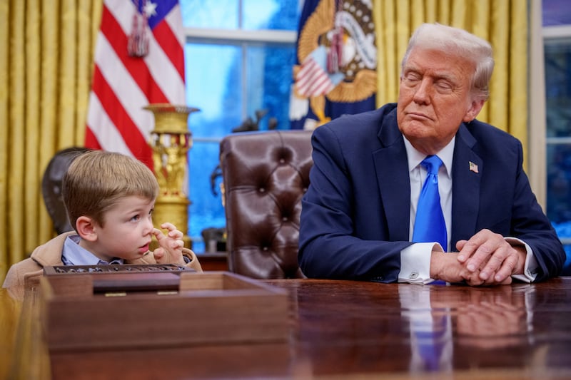 X Musk, the son of Tesla and SpaceX CEO Elon Musk, stands next to U.S. President Donald Trump during an executive order signing in the Oval Office at the White House on February 11, 2025 in Washington, DC.