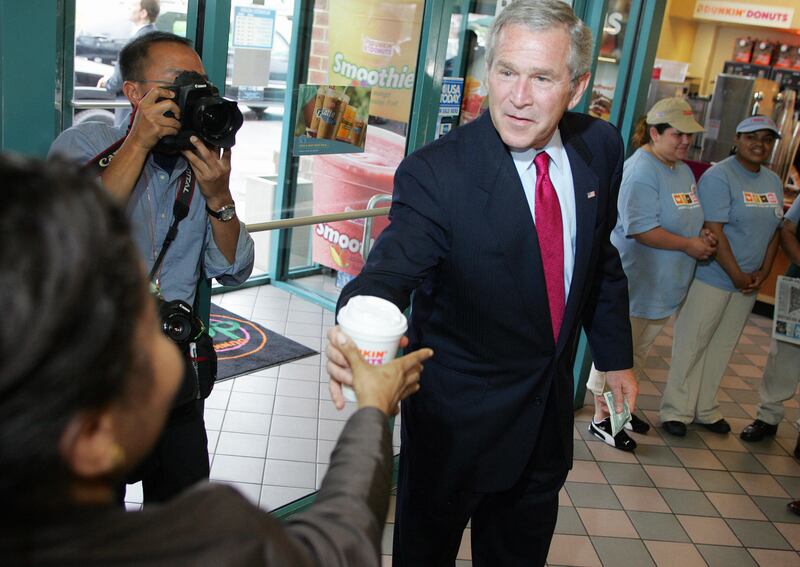 George W. Bush in 2006, buying April Ryan a cup of coffee as she asked him questions.
