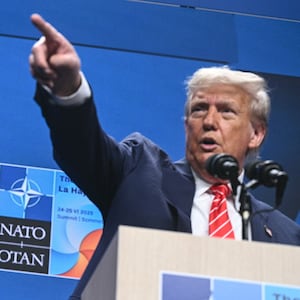 US Defense Secretary Pete Hegseth (L) looks on as US President Donald Trump (R) gestures at a press conference during a North Atlantic Treaty Organization (NATO) Heads of State and Government summit in The Hague on June 25, 2025. NATO leaders hold a two-day summit on June 24 and 25 in The Hague. (Photo by Brendan SMIALOWSKI / AFP) (Photo by BRENDAN SMIALOWSKI/AFP via Getty Images)
