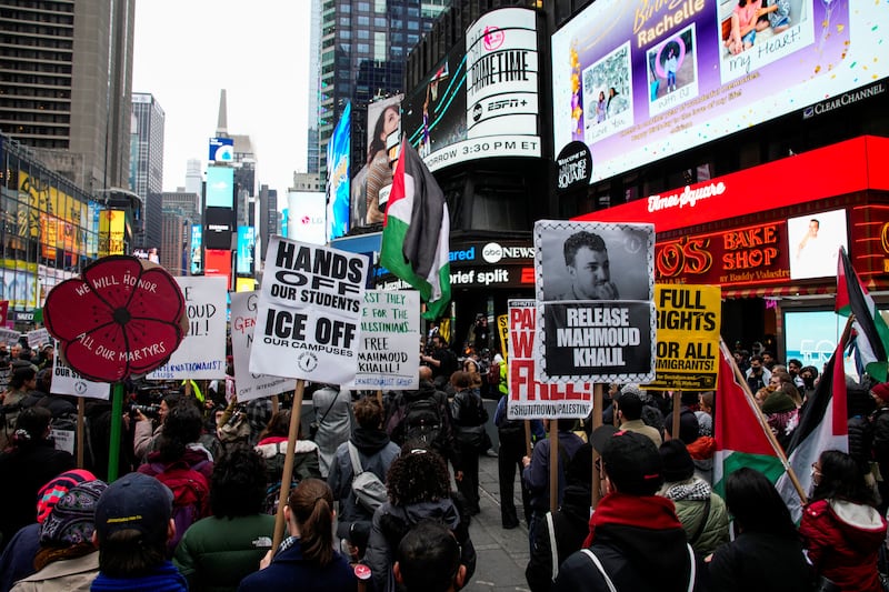 Protestors rally in Times Square and call for the release of Mahmoud Khalil.