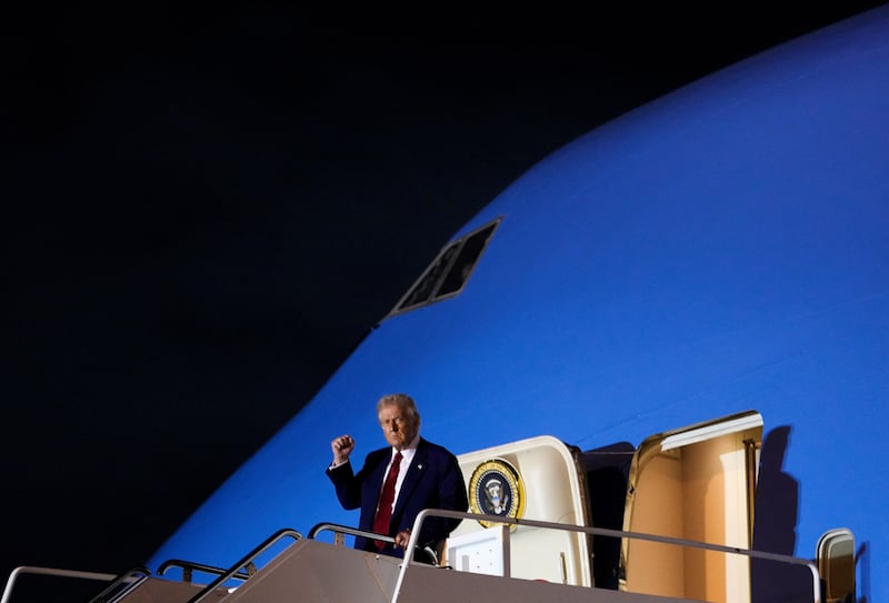 President Donald Trump gestures as he disembarks Air Force at Palm Beach International Airport in West Palm Beach, Florida, on April 3, 2025.