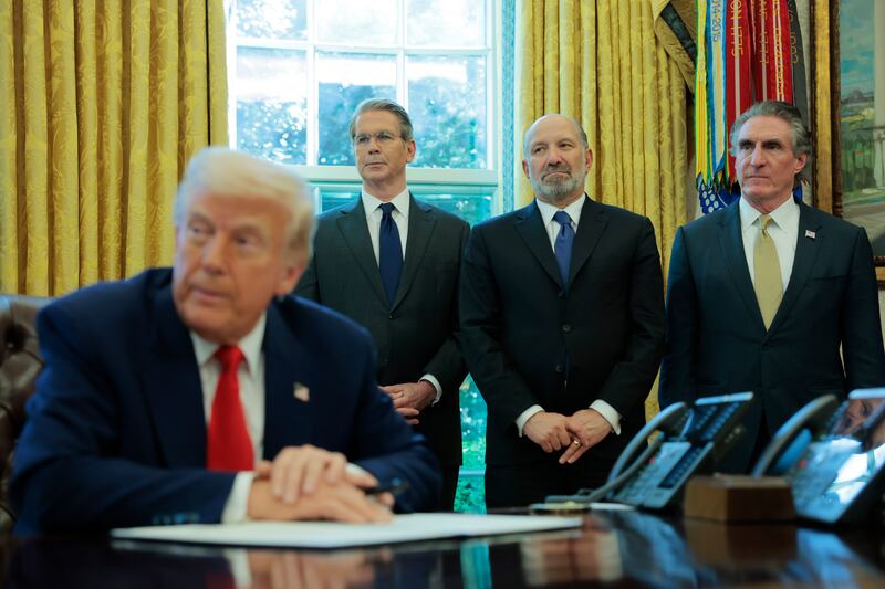 President Donald Trump signs an executive order as (L-R) U.S. Treasury Secretary Scott Bessent, Secretary of Commerce Howard Lutnick and Interior Secretary Doug Burgum look on in the Oval Office of the White House on April 09, 2025 in Washington, DC.