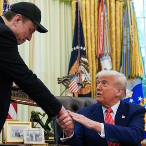 President Donald Trump shakes hands with Elon Musk after Trump gifted him with a “key to the White House” during a news conference in the Oval Office of the White House in Washington, DC, on May 30, 2025.