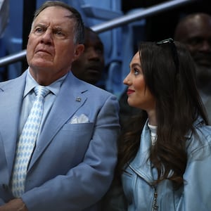 Bill Belichick and his girlfriend Jordon Hudson look on.