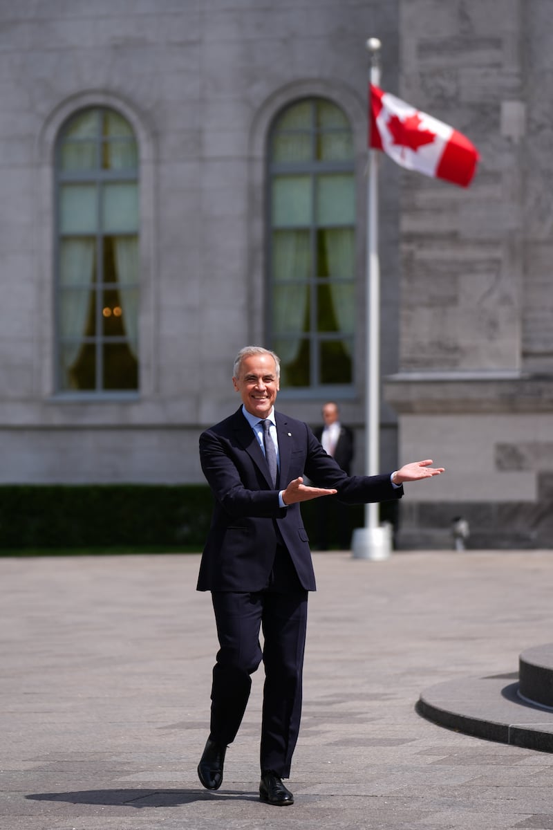 Canadian Prime Minister Mark Carney speaks to the media after the swearing-in ceremony of the new cabinet at Rideau Hall in Ottawa on May 13, 2025.